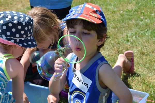 Child blowing bubbles at Summer Camp Child blowing bubbles at Summer Camp