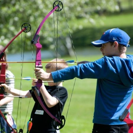 Children learning archery Children learning archery